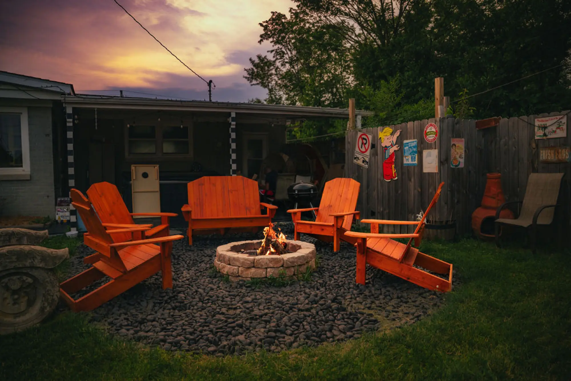 Chairs around the fire at sunset